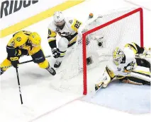  ?? BRUCE BENNETT/GETTY IMAGES ?? Nashville Predators centre Frederick Gaudreau scores a goal against Pittsburgh Penguins goaltender Matt Murray during Game 4 of the Stanley Cup final on Monday in Nashville, Tenn.