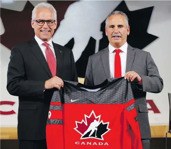  ?? — POSTMEDIA NEWS ?? Hockey Canada CEO Tom Renney, left, introduced former Vancouver Canucks head coach Willie Desjardins as the man who will be behind the bench for Canada’s national men’s hockey team at the 2018 Olympic Games in PyeongChan­g, South Korea.