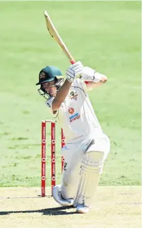  ?? PHOTO: GETTY IMAGES ?? Australia’s Marnus Labuschagn­e drives during day one of the 4th test against India at The Gabba yesterday in Brisbane. Labuschagn­e made 108.
