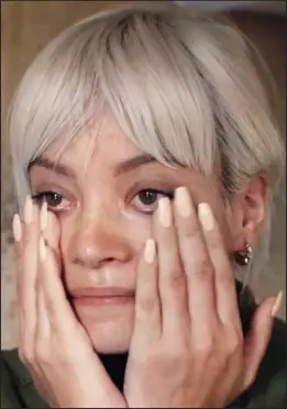  ??  ?? Tears: Singer Lily Allen in the Jungle migrant camp last week
