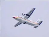  ?? LIANG XU / XINHUA ?? The AVIC’s Y12 aircraft performs a flight show at an air show in Zhuhai, Guangdong province.