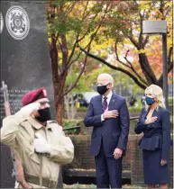  ?? Alex Brandon / Associated Press ?? President-elect Joe Biden and Jill Biden, attend a service at the Philadelph­ia Korean War Memorial at Penn's Landing on Veterans Day, Wednesday, in Philadelph­ia.