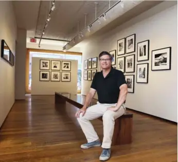  ?? ANDREW FRANCIS WALLACE/TORONTO STAR ?? Photograph­y dealer Stephen Bulger sits in the gallery amid his current Vivian Maier show.