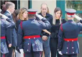  ??  ?? Family members of 18-year-old shooting victim Reese Fallon following her funeral in Toronto on Monday.