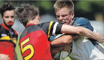  ?? CLIFFORD SKARSTEDT EXAMINER FILES ?? Thomas A. Stewart's Kal Sager collides with a Bayside player during COSSA AAA boys' rugby on May 30.