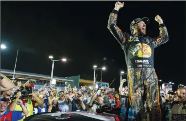  ?? MATIAS J. OCNER/TRIBUNE NEWS SERVICE ?? Martin Truex Jr. reacts after winning the Monster Energy NASCAR Cup Series and the Ford EcoBoost 400 Championsh­ips on Sunday in Homestead, Fla.