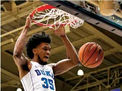  ?? AP Photo/Ben McKeown ?? ■ Duke’s Marvin Bagley III (35) dunks the ball during the first half against Virginia in Durham, N.C. Bagley dominated at Duke, while fellow freshman Michael Porter Jr. barely saw action at Missouri because of injury. Yet they’ll likely be the first forwards to hear their names called during Thursday’s draft. Bagley is a possible No. 1 overall pick and double-double machine with a long frame.