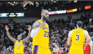  ?? Gerald Herbert The Associated Press ?? Lakers forward Lebron James had 23 points to help Los Angeles top New Orleans and earn the seventh seed in the Western Conference.