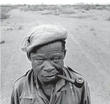  ??  ?? SERVICEMAN: A soldier at Schmidtsdr­ift, South Africa, 1992. In 1974 the South African Defence Force Infantry Battalion establishe­d a military training base at Schmidtsdr­ift. After Namibia's independen­ce in 1990, members of 31 Battalion (the so-called...