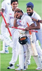  ??  ?? Rishabh Pant (C) celebrates with teammates at The Gabba in Brisbane on Tuesday.