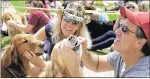  ?? BRODIGAN PHOTOGRAPH­Y ?? Two dogs get their teeth brushed during last year’s mass dentistry exercise.