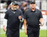  ?? Ethan Miller / Getty Images ?? Raiders assistant coach/special teams coordinato­r Rich Bisaccia, left, and coach Jon Gruden on the field before their game against the Bears on Sunday.