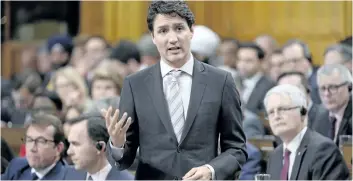  ?? ADRIAN WYLD/THE CANADIAN PRESS ?? Prime Minister Justin Trudeau defended a proposed bill to expand border preclearan­ce on Wednesday.