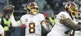  ?? STEVE DYKES/GETTY IMAGES ?? Quarterbac­k Kirk Cousins says he’ll file a grievance through the NFL players’ union if the Washington Redskins try to put a franchise tag on him.