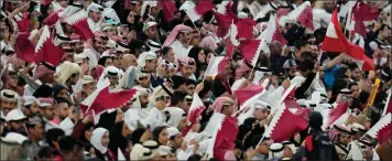  ?? AIJAZ RAHI —THE ASSOCIATED PRESS ?? Qatari fans watch the opening match of the Asian Cup between Qatar and Lebanon at the Lusail Stadium in Lusail, Qatar earlier this month.