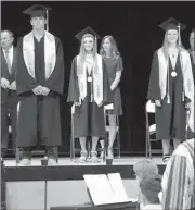  ?? Alex Eller ?? Above, Tyson Brott, Darla Nichols and Cortnee Eberle stand during the presentati­on of the Class of 2020.