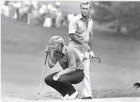  ??  ?? Jack Nicklaus kneels while partner Arnold Palmer looks over his shoulder during the 1972 PGA national team championsh­ip. Palmer, who died Sunday at age 87, made an impact on golf that went beyond his considerab­le talent and achievemen­ts on the course.