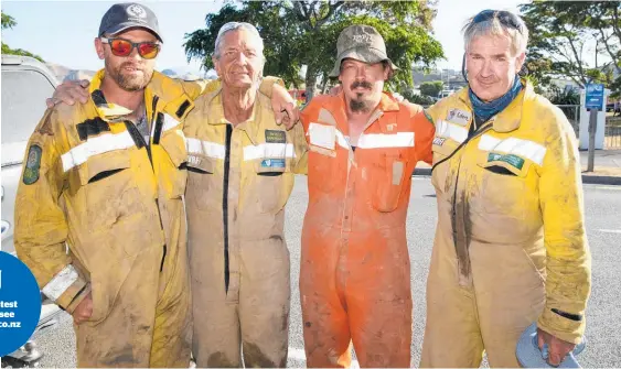  ?? Photos / Mark Mitchell ?? Canterbury volunteer firefighte­rs (from left) Ewen Peat, Neville Barkhausen, Justin Gilmore and Tim Eden after their 12-hour shift. Below, Happy Wakefield Four Square owner Phil Bell (left) and residents stream back into town.