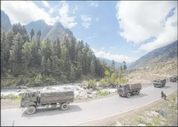  ?? Mukhtar Khan The Associated Press ?? An Indian army convoy moves Tuesday in Indian-controlled Kashmir. India said it thwarted actions by China’s military near a disputed border in the Ladakh region.