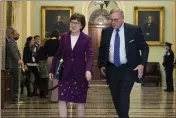  ?? STEVE HELBER — THE ASSOCIATED PRESS ?? Sen. Susan Collins and Sen. Richard Burr walk to the Senate chamber for the impeachmen­t trial of President Donald Trump on Wednesday.