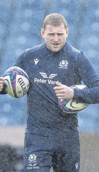  ?? ?? Finn Russell at a rainy Murrayfiel­d as Scotland prepared for today’s clash with Argentina