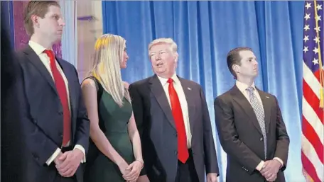  ?? Carolyn Cole Los Angeles Times ?? DONALD TRUMP with children Eric, from left, Ivanka and Donald Jr. at Trump Tower in New York. In his first full news conference in almost six months, the president-elect put his independen­ce and refusal to follow Washington convention on vivid display.