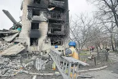  ?? ?? Rescuers enter rubble of house in Borodianka, Ukraine