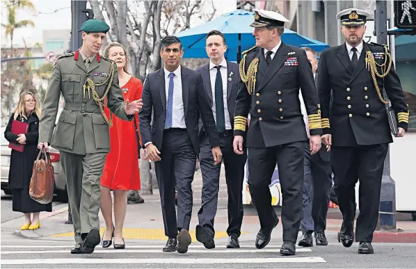  ?? ?? Prime Minister Rishi Sunak on his flying visit to San Diego, California, for a defence summit with the US and Australia with, from left, Col Jaimie Norman, Adml Sir Ben Key, the First Sea Lord, and Cmdr Gus Carnie