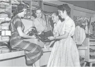  ?? Houston Chronicle file photo ?? Isabell Gerhart, second from left, checks merchandis­e in her River Oaks store in 1950 with saleswomen.