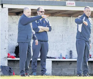  ??  ?? Frustratin­g day East Kilbride boss Martin Lauchlan calls the shots from the sidelines