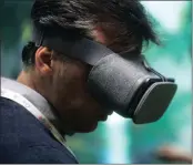  ?? PHOTO: BLOOMBERG ?? An attendee uses a Daydream View virtual reality headset during an event at Google’s office in London last year.