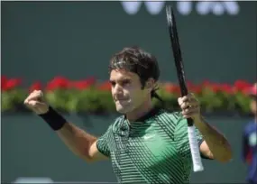  ?? MARK J. TERRILL — THE ASSOCIATED PRESS ?? Roger Federer celebrates his semifinal win against Jack Sock at the BNP Paribas Open in Indian Wells, Calif. on Saturday.