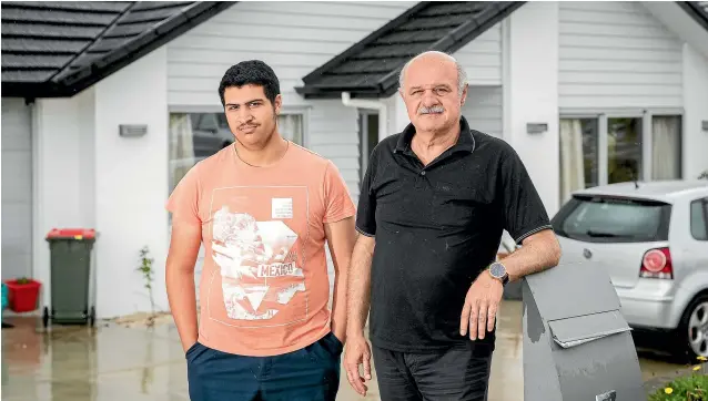  ?? DOMINICO ZAPATA/STUFF ?? Ahmed Alubaidi and his son Abdul Azeez Ahmed, 15, in the Tuakau Housing New Zealand home that was the subject of a poison-pen campaign before they moved it.