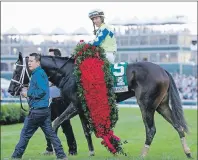  ?? AP PHOTO ?? John Velazquez celebrates after riding Always Dreaming to victory in the 143rd running of the Kentucky Derby horse race at Churchill Downs Saturday in Louisville, Ky.