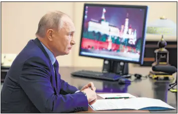  ?? Mikhail Metzel The Associated Press ?? Russian President Vladimir Putin attends a cabinet meeting via videoconfe­rence at the Novo-ogaryovo residence outside Moscow on Wednesday.