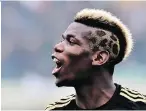  ?? GIUSEPPE CACACE/GETTY IMAGES ?? Players like France’s Paul Pogba use fashion “as a form of creative personal expression.”