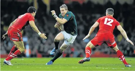  ?? Picture: GETTY IMAGES ?? TAKING THE GAP: Springbok captain Jean de Villiers splits the Welsh defence in last night’s game