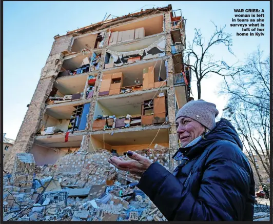  ?? ?? WAR CRIES: A woman is left in tears as she surveys what is
left of her home in Kyiv