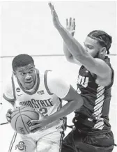  ?? ROBERT FRANKLIN/AP ?? OSU’s E.J. Liddell, left, received threatenin­g social media messages after OSU’s loss Friday.