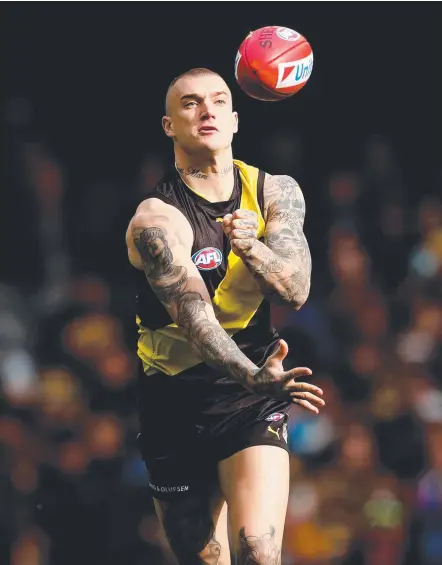  ?? Picture: GETTY IMAGES ?? Richmond star Dustin Martin has escaped with a fine for his hit on Lions niggler Nick Robertson.
