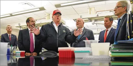  ?? HYOSUB SHIN / HYOSUB.SHIN@AJC.COM ?? President Donald Trump, flanked by Gov. Brian Kemp and other officials during a visit to the CDC in March, is facing criticism about his approach to the coronaviru­s pandemic as he returns to the state today. Also, polls show him neck-and-neck with Democrat Joe Biden as Republican­s try to defend a state they have carried in every presidenti­al vote since 1996.