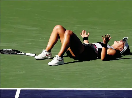  ?? MATTHEW STOCKMAN/GETTY IMAGES ?? Bianca Andreescu lets out a scream of joy after winning the BNP Paribas Open Sunday afternoon.