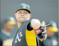  ?? DARRON CUMMINGS/ASSOCIATED PRESS ?? Jesse Hahn, obtained in the offseason after his strong rookie season for the Padres, is vying for a job in the A’s rotation. Steelers fan but not so much a Pirates fan.”
Hahn’s years of rooting for the underdog over those bigpayroll powerhouse­s will...