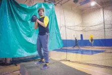  ?? EDDIE MOORE/JOURNAL ?? Roby Romero, who plays in the Mexican League, pitches at the E&amp;G Baseball Academy in Santa Fe last week at the old Boys and Girls Club on Alto Street.