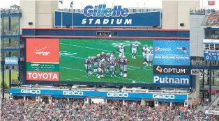  ?? STEW MILNE/AP ?? A general view of the Gillette Stadium sign above the video board during the first quarter of a game between the New England Patriots and the Oakland Raiders in 2014, in Foxborough, Mass.