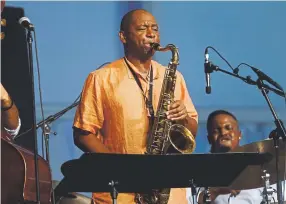  ?? John Davisson, Associated Press file ?? Branford Marsalis and this quartet perform at the 2014 New Orleans Jazz & Heritage Festival.