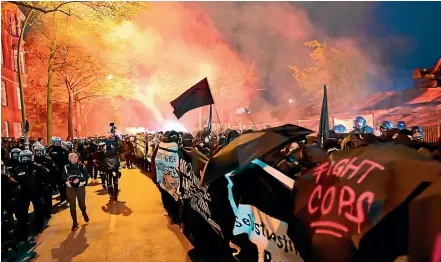  ?? AP ?? Protesters set off pyrotechni­cs at the Revolution­ary May Day Demonstrat­ion on May 1 in Berlin.