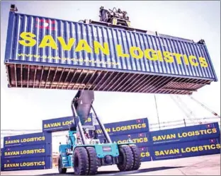  ?? VIENTIANE TIMES ?? A container is moved at the Savan Park Zone C dry port in Laos.