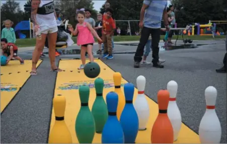  ?? MARIAN DENNIS — DIGITAL FIRST MEDIA ?? Bowling was one of the most popular games at the 90th birthday celebratio­n for Rupert Elementary in Pottstown.