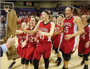  ?? FILE PHOTO ?? Pocahontas players, led by Anna Baltz, No. 12; Ashlyn Ellis, No. 11; and Kristen Wiseman, No. 15, run to the Class 4A State Championsh­ip trophy after their overtime win over Pottsville at the Bank of the Ozarks Arena in Hot Springs on March 11.